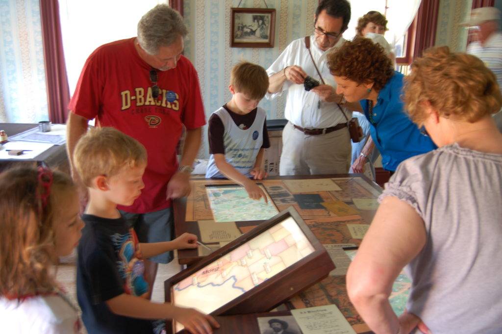 Children and families using digital map interactives
