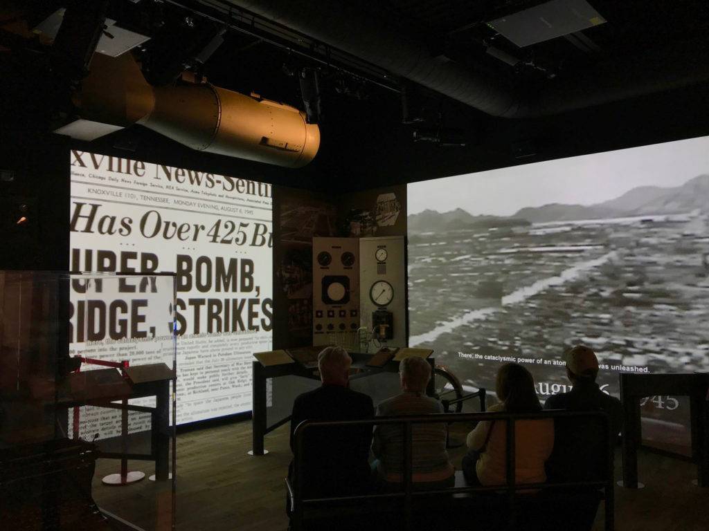Two threater screens with World War 2 Footage, Headline: "Super Bomb"